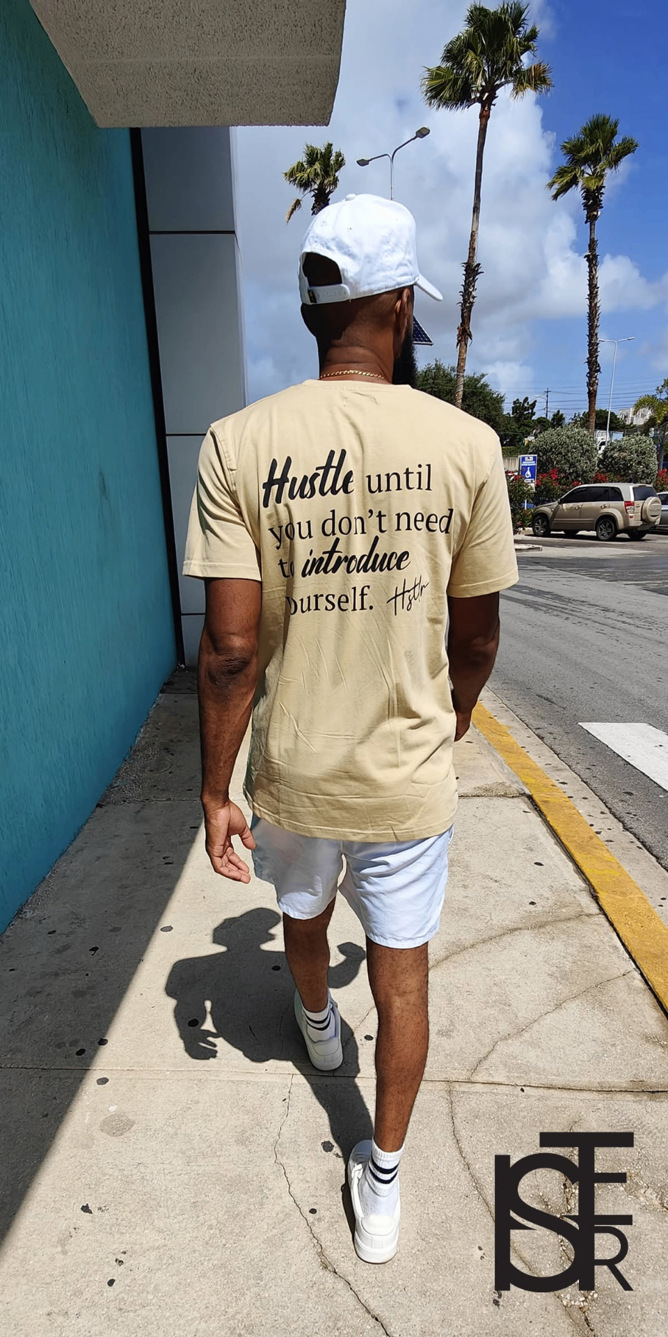 Man wearing the BERAHTY Hustler tee — 'Hustle until you don't need to introduce yourself'